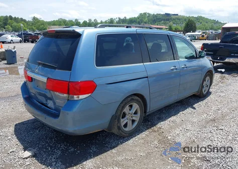 2010 Honda Odyssey Touring z USA, uszkodzony, nr VIN 5FNRL3H93AB058240